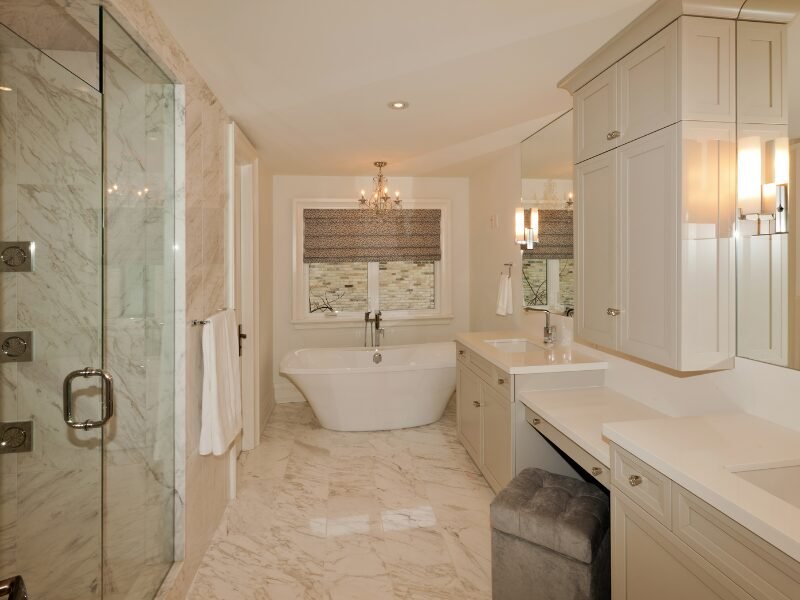 Newly renovated bathroom with dual sink vanity, tile floors, and glass walk-in shower in Fort Mill, SC.